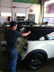 man working on window tinting 